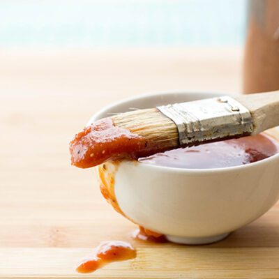 Small white bowl filled with homemade bbq sauce recipe