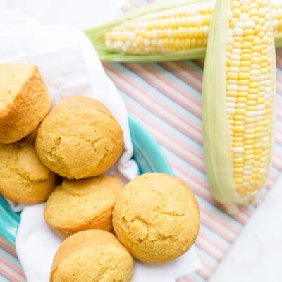 Overhead picture of cornbread muffins in blue bowl