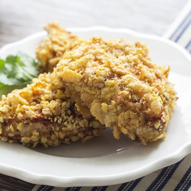 Up close picture of baked fried chicken recipe on a white plate