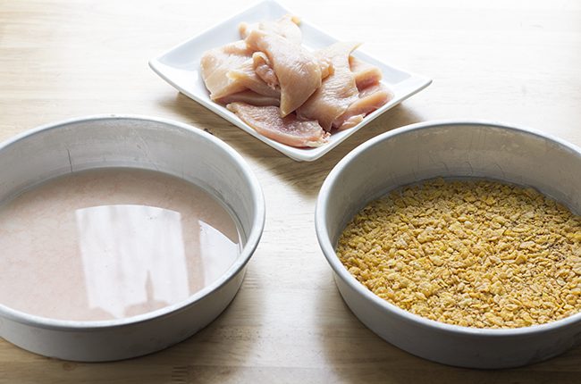 Ingredients for oven fried chicken recipe laying on a table