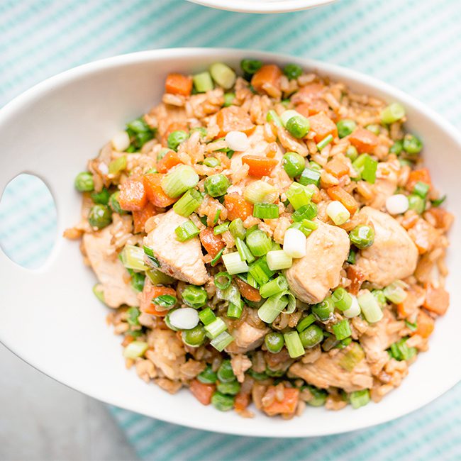 overhead shot of chicken fried rice in dish