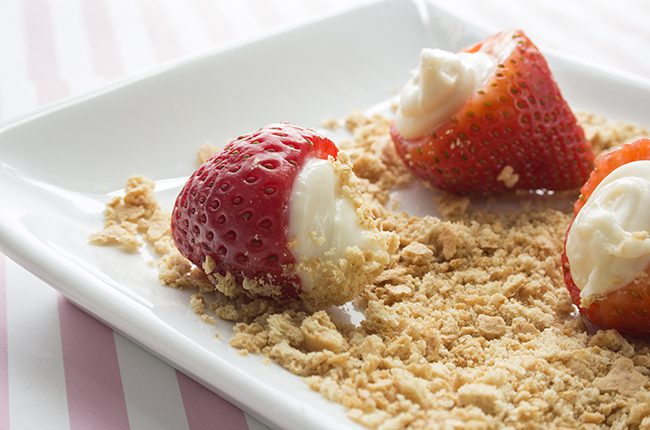 roll the strawberries in the crumbs