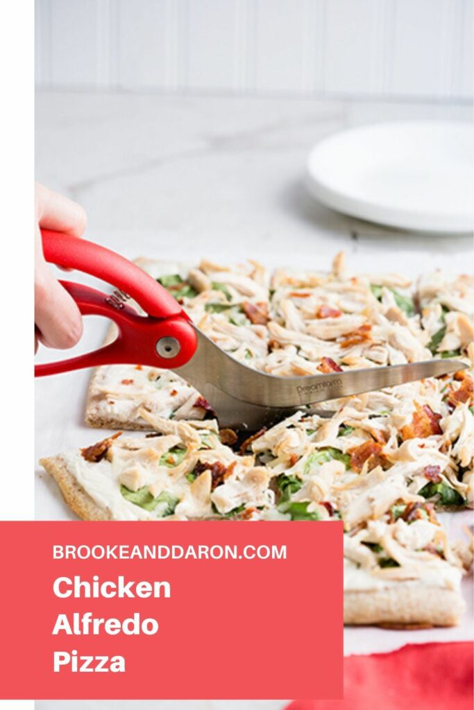 Pizza being cut with pizza shears