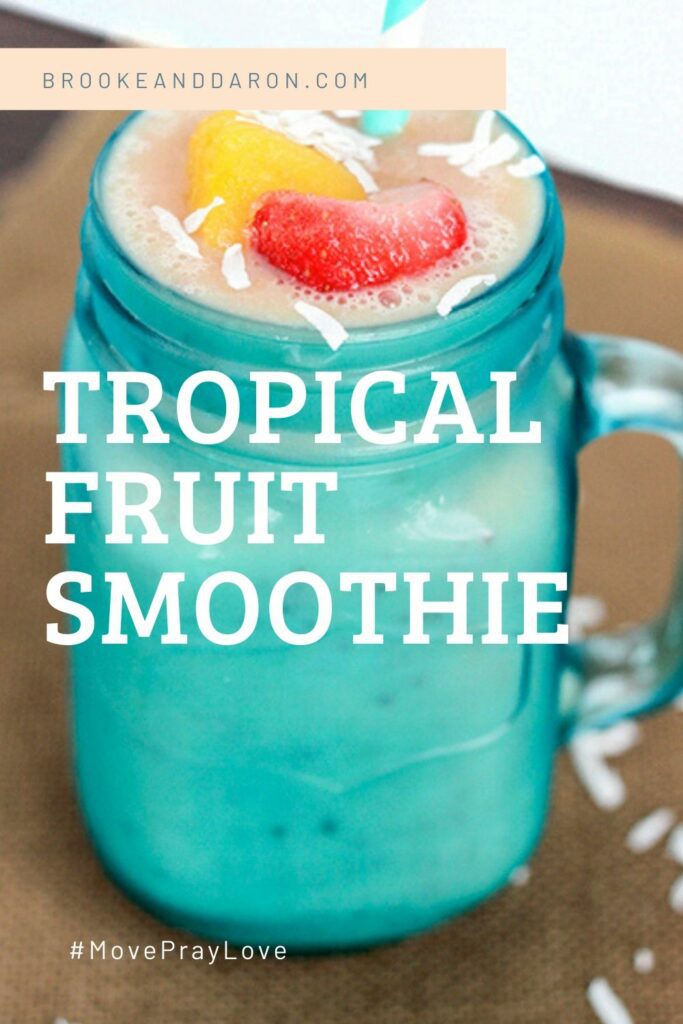 Blue mason jar glass filled with smoothie