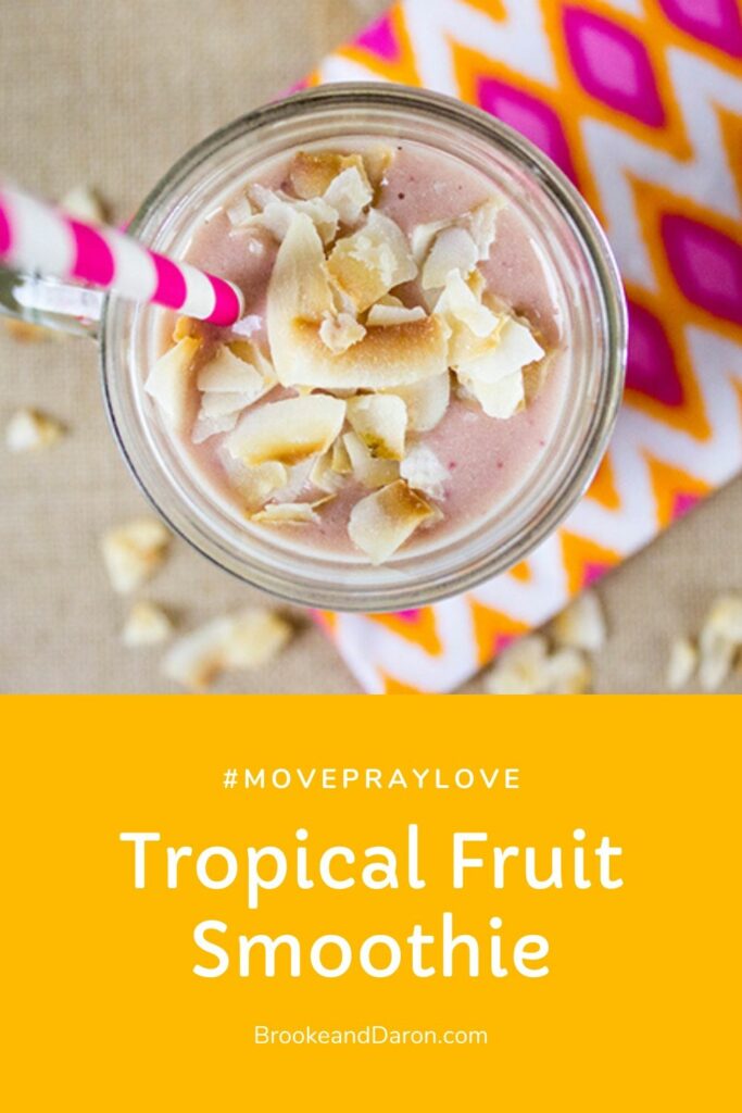 Glass jar of smoothie on pink and orange napkin