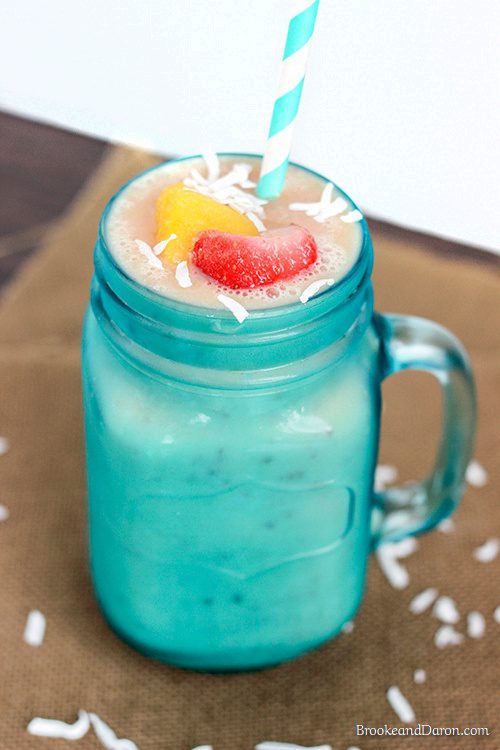 Blue mason jar glass filled with smoothie