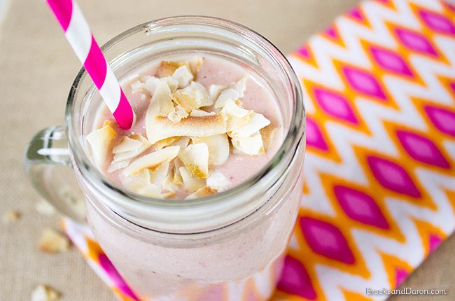 Glass jar of smoothie on pink and orange napkin