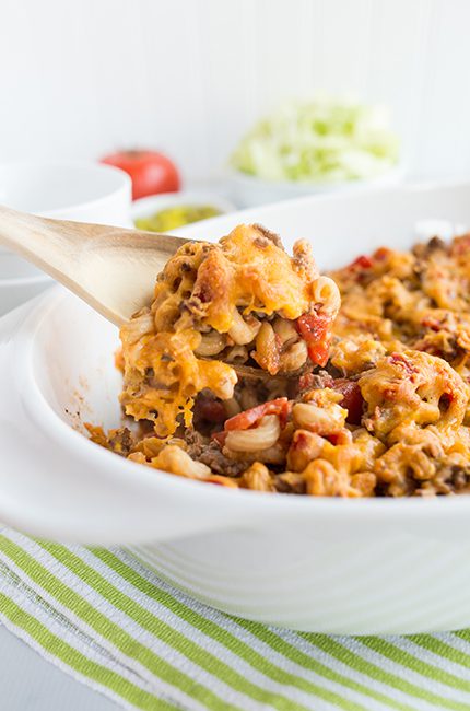 Up close long picture of a spoon of cheeseburger casserole