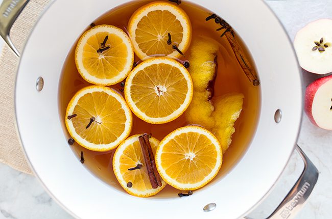 Apple cider being brewed in a large pot