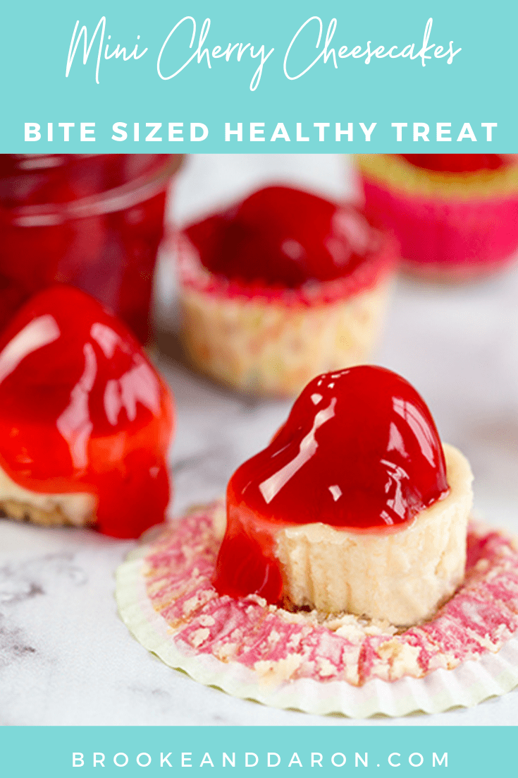 Mini Cheesecakes on a marble counter topped with cherry pie filling