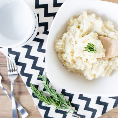 Overhead picture of large white bowl of potato parsnip mash