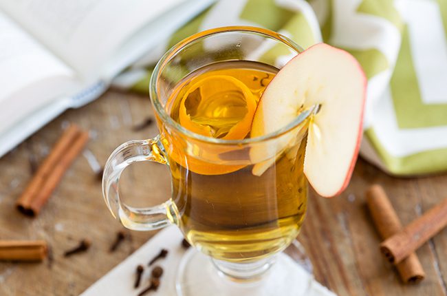 Small glass mug of spiced apple cider