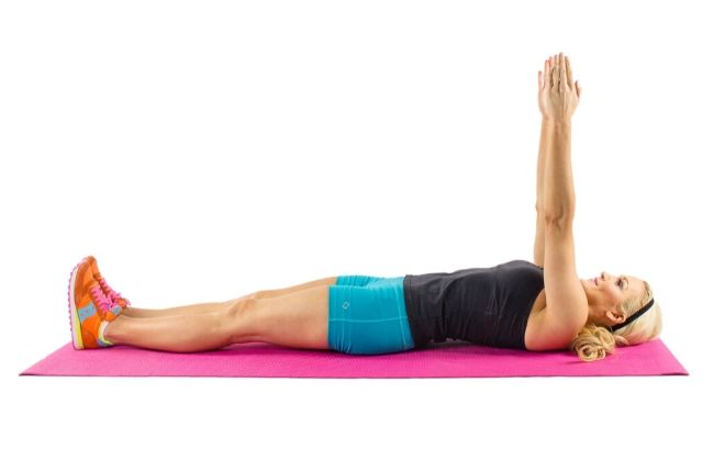 girl doing pilates sit up in beginner ab workout plan