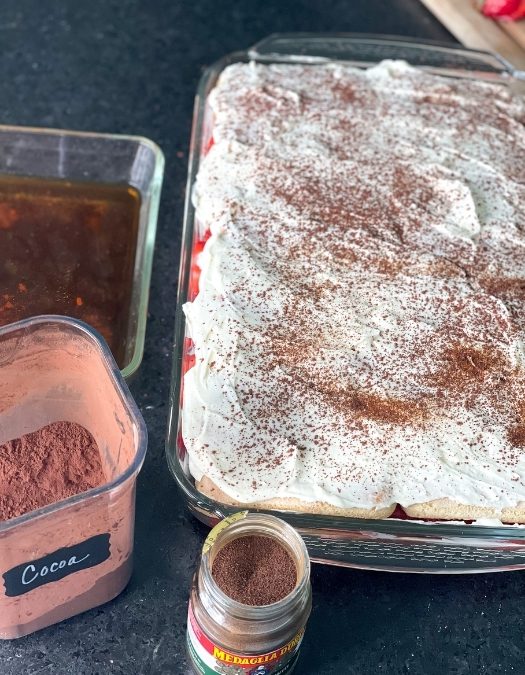 sift cocoa powder on dessert